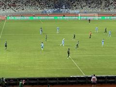 Shenzhen Peng City players competing against Beijing Guoan in a Chinese Super League football match on 26 July 2024