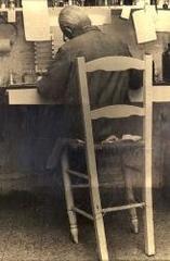 Portrait of Luis Federico Leloir sitting in his laboratory chair