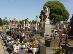 Melbourne General Cemetery in Carlton, Melbourne with green landscapes and tombstones under a partly cloudy sky