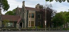Melbourne General Cemetery Gatehouse entrance with surrounding greenery