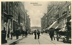 Old postcard of Haarlemmerdijk street in Amsterdam with historic buildings