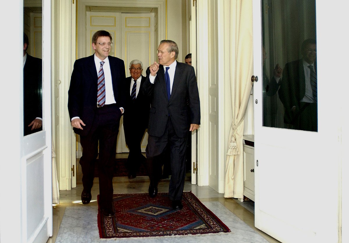 Belgian Prime Minister Guy Verhofstadt and US Secretary of Defense Donald H. Rumsfeld exiting after a meeting in Brussels