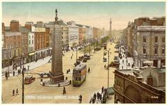 Early 20th century view of Upper O'Connell Street, Dublin with trams, Parnell Monument, and Nelson's Pillar