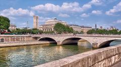Pont au Change bridge over the Seine River in Paris with historic buildings in the background