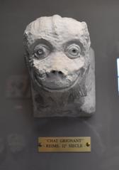 Close-up of a snarling cat sculpture at Musée Saint Rémi in Reims
