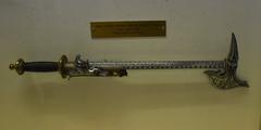 Musée Saint Rémi historical weapon combining an axe and flintlock pistol
