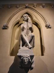 Harpe player statue inside Musée Saint Rémi in Reims