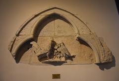 Carved stone tympanum at Musée Saint Rémi in Reims