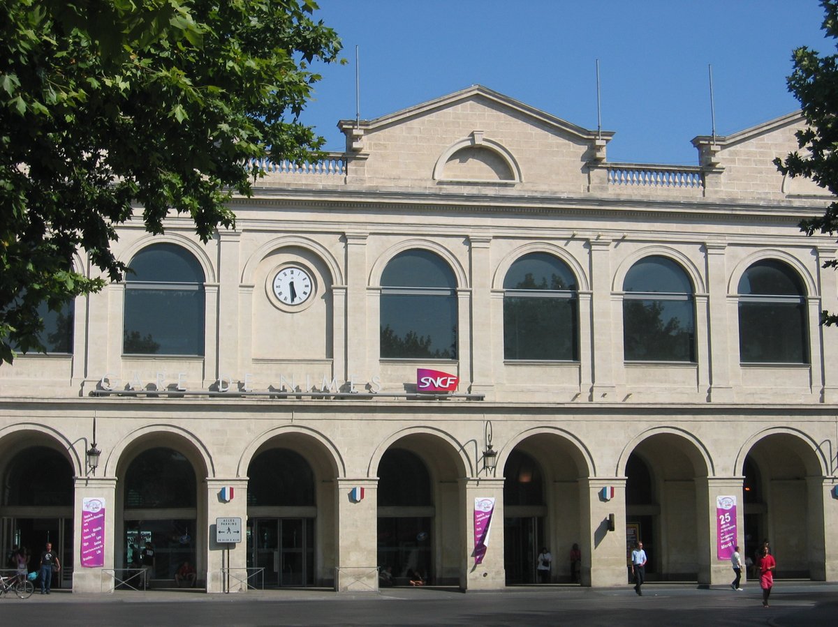 Exterior view of Gare de Nîmes railway station with modern architectural design