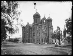Exterior view of the B'nai B'rith Temple on Hope Street and Ninth Street in Los Angeles circa 1902 showing tall three-story building with onion domes