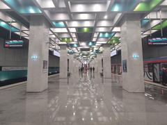 Universitet Druzhby Narodov subway station platform with modern design and passengers