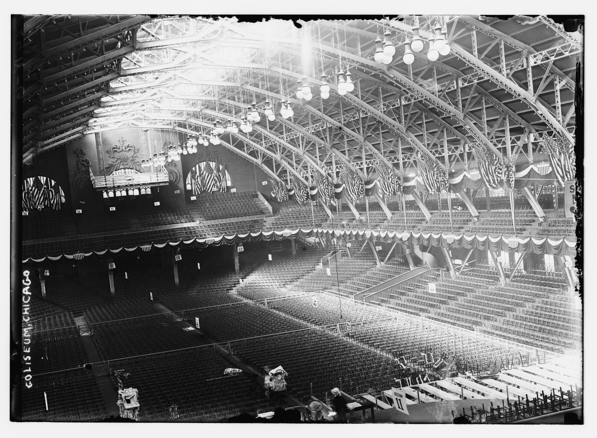 Interior view of the Chicago Coliseum showing large crowd and stage