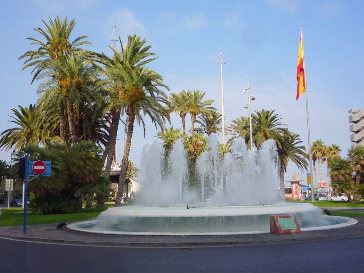 Scenic view of Plaza Puerta del Mar in Alicante with historic buildings and palm trees