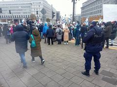 Pro-Israeli protest in Warsaw with people holding flags and banners