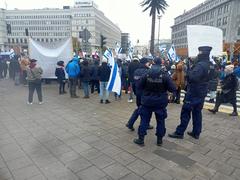Pro-Israeli protest in Warsaw with demonstrators holding flags and banners