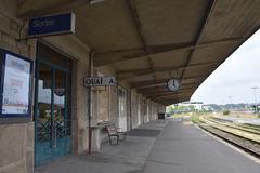 Gare de Dinan train station platform with old train and vintage architecture