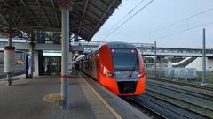 Red and white Russian electric train ES2G-101 at Moscow MCC ZIL station in May 2019