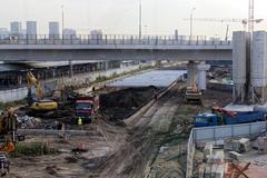 Construction site of ZIL subway station in Moscow with cranes and building framework in August 2023