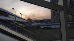 Zil bridge in Moscow cityscape with visible green trees and urban buildings under blue sky