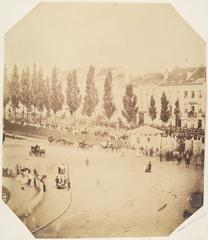 Crowded urban square with people during September festivals
