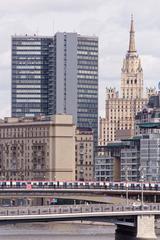 View of Moscow cityscape from Bogdana Khmelnitskogo bridge with river and buildings in June