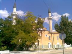 Street view of Evpatoria with buildings and a street lamp under a clear blue sky