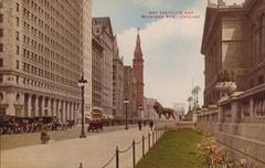 Art Institute building and Michigan Avenue street in Chicago with busy traffic and tall buildings