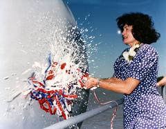 USS Rushmore dock landing ship christening ceremony with Meredith A. Brokaw breaking champagne bottle on ship's bow
