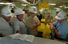Chief of Naval Operations Adm. Mike Mullen at engineering systems control station aboard Pre-Commissioning Unit New Orleans LPD 18 with Raytheon and Northrop Grumman managers