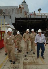 Chief of Naval Operations Adm. Mike Mullen listens to Cmdr. Brad Skillman at Northrop Grumman Shipyard Avondale