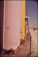 Fuel storage tanks painted with color patterns for industrial color psychology experiments at Avondale Shipyard