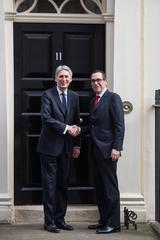 Steven Mnuchin and Philip Hammond meeting at 11 Downing Street in London discussing G20 and G7 economic growth and job promotion