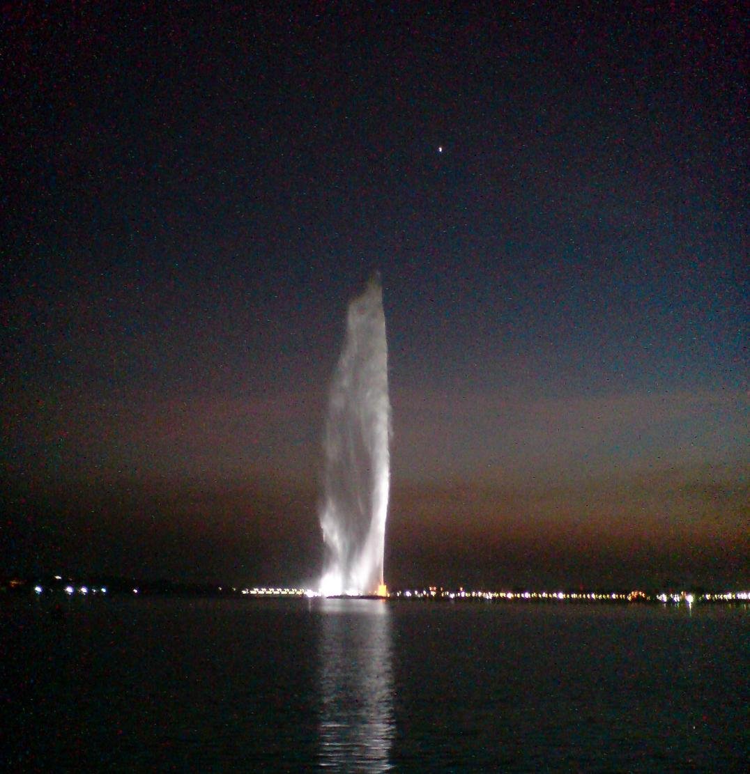 King Fahd Fountain spraying water high into the air at night in Jeddah, Saudi Arabia