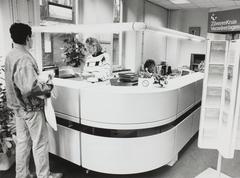 Black and white photo of the interior shop/counter area of the Academisch Ziekenhuis Leiden (Academic Hospital Leiden) taken in 1991