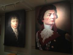 Two painted portraits of Thaddeus Kosciuszko as a boy and as a soldier inside Thaddeus Kosciuszko National Memorial in Pennsylvania