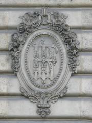 Monogram RF on the wall at the entrance of the Hôtel des Monnaies in Paris 6th arrondissement