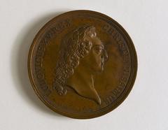 Medal depicting a laurel-headed bust of Louis XV on the front and the façade of the Hôtel des Monnaies on the Seine on the back