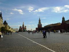 The Moscow Kremlin with its historic towers and red brick walls under a clear blue sky