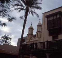 Coptic Quarter in Cairo with historic buildings and palm trees