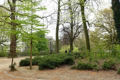 Leopold Park in Brussels Belgium with green trees and sunny sky