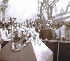 Abul Barkat's family standing in front of Shaheed Minar foundation stone in Dhaka, 21 February 1956