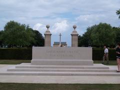 Bény-sur-Mer Canadian War Cemetery with rows of white headstones and lush green grass