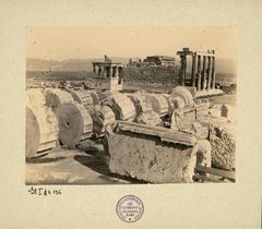 South view of the Erechtheion from the Parthenon with archaeological ruins and benches visible