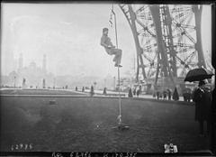Early 20th century image of experimental work at the Eiffel Tower using a device called 'ouistiti' to move along smooth ropes for difficult access tasks in Paris, France