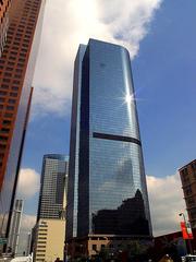 Downtown cityscape with modern skyscrapers under blue sky