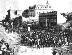 A procession advancing on Avenida Santa Fe towards Plaza Italia for the foundation stone placement of the Garibaldi Monument in Buenos Aires, Argentina