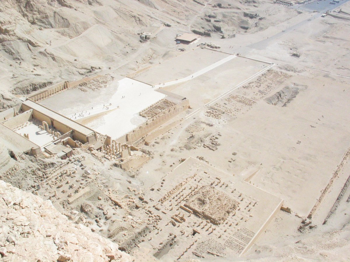 Deir el Bahri temples from top of cliff showing Hatshepsut's temple on left, Tuthmosis III's temple center, Montuhotep II's temple right