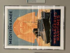 Vintage poster of Messageries Maritimes ship company with a large ship sailing at sea