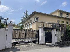Italian Embassy building in Tokyo with modern glass facade and flags