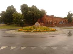 Plac Związku Nauczycielstwa Polskiego in Toruń with a central monument stone dedicated to the Polish Teachers' Union